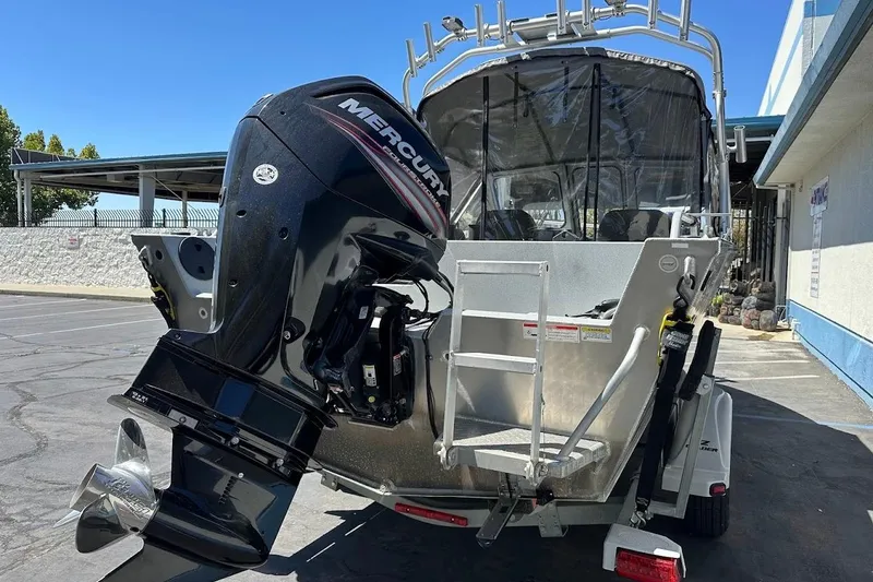 Slide: The Image of 2017 Duckworth 18 Advantage boat with Mercury outboard motor, parked on a trailer. - 10