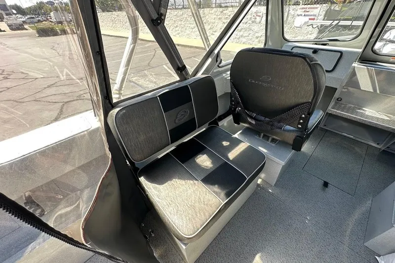 Slide: The Image of Interior of a 2017 Duckworth 18 Advantage boat with seating and dashboard. - 18