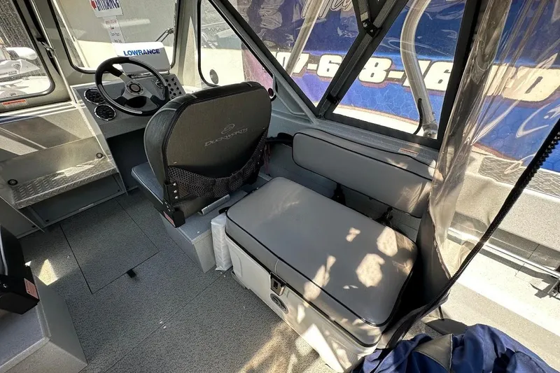 Slide: The Image of Interior of 2017 Duckworth 18 Advantage boat with seating and steering wheel. - 19