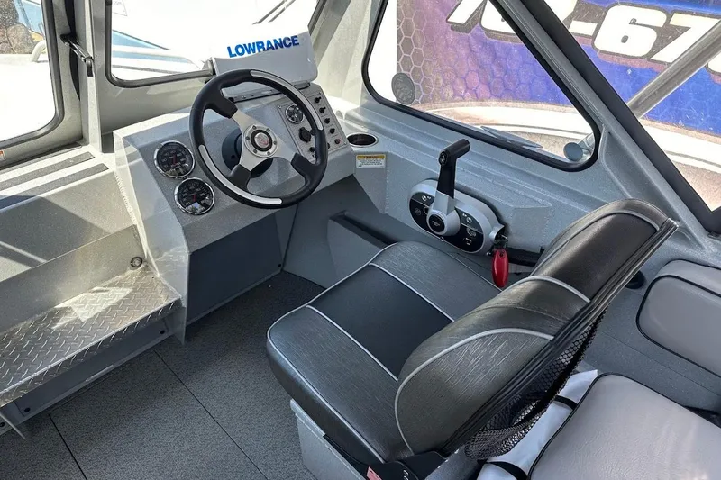 Slide: The Image of 2017 Duckworth 18 Advantage boat interior with steering wheel and control panel. - 25