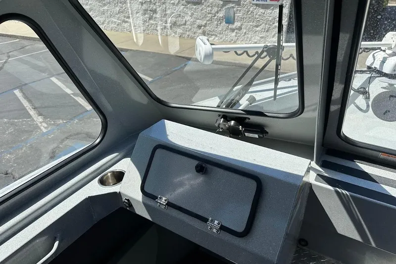 Slide: The Image of Interior view of a 2017 Duckworth 18 Advantage boat, showcasing dashboard and windows. - 29
