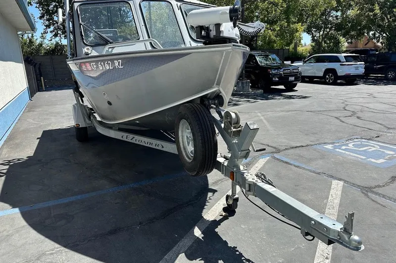 Slide: The Image of 2017 Duckworth 18 Advantage boat on trailer in parking lot. - 4