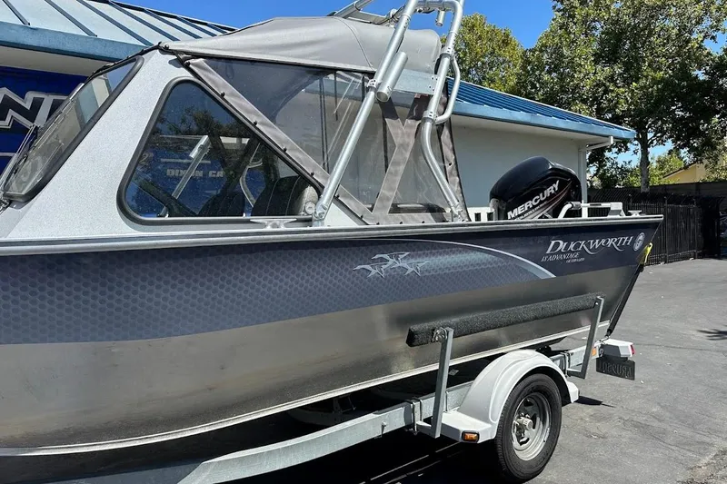Slide: The Image of 2017 Duckworth 18 Advantage boat on trailer, featuring a Mercury outboard motor. - 6