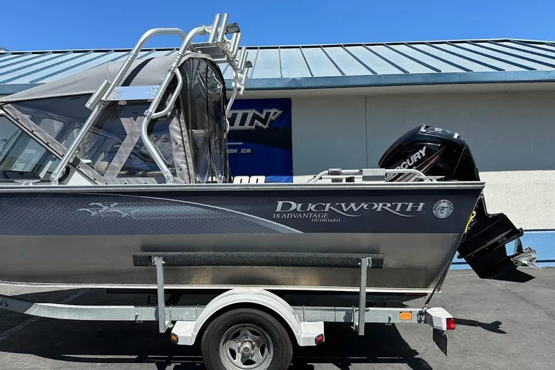 Slide: The Image of 2017 Duckworth 18 Advantage boat on trailer, featuring a Mercury outboard motor. - 7
