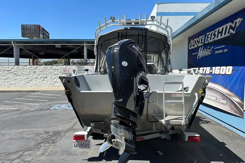 Slide: The Image of 2017 Duckworth 18 Advantage boat with outboard motor in parking lot. - 9