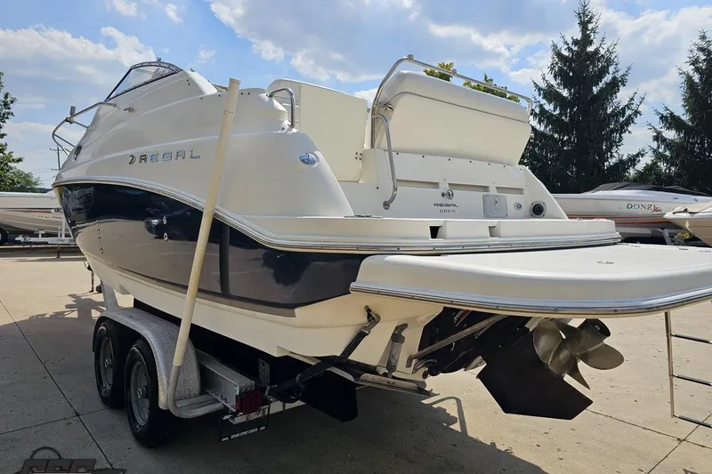 Slide: The Image of 2003 Regal Commodore 2665 boat on trailer, rear view, sunny day. - 23