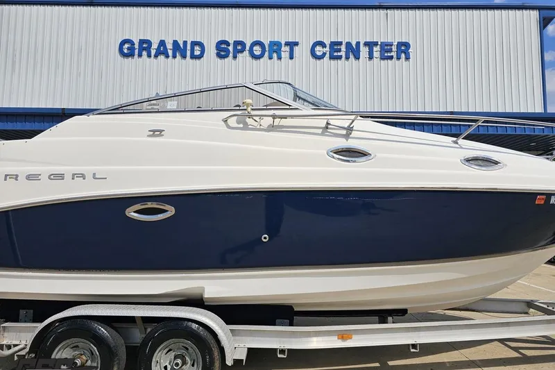 Slide: The Image of 2003 Regal Commodore 2665 boat on trailer at Grand Sport Center. - 3