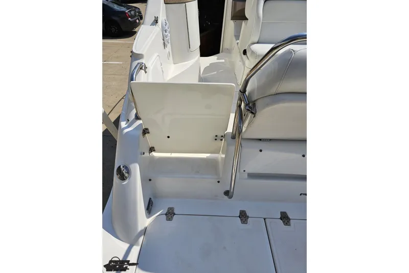 Slide: The Image of 2003 Regal Commodore 2665 boat interior with open hatch and seating area. - 35