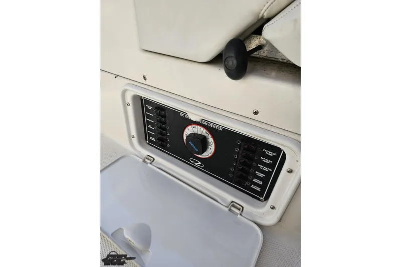 Slide: The Image of Control panel of 2003 Regal Commodore 2665 boat with switches and dials. - 38