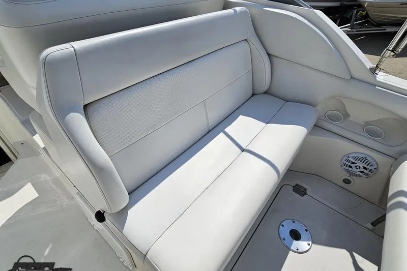 Slide: The Image of 2003 Regal Commodore 2665 boat interior with white seating and speaker system. - 40