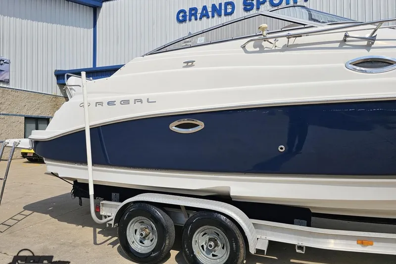 Slide: The Image of 2003 Regal Commodore 2665 boat on trailer at Grand Sport facility. - 5