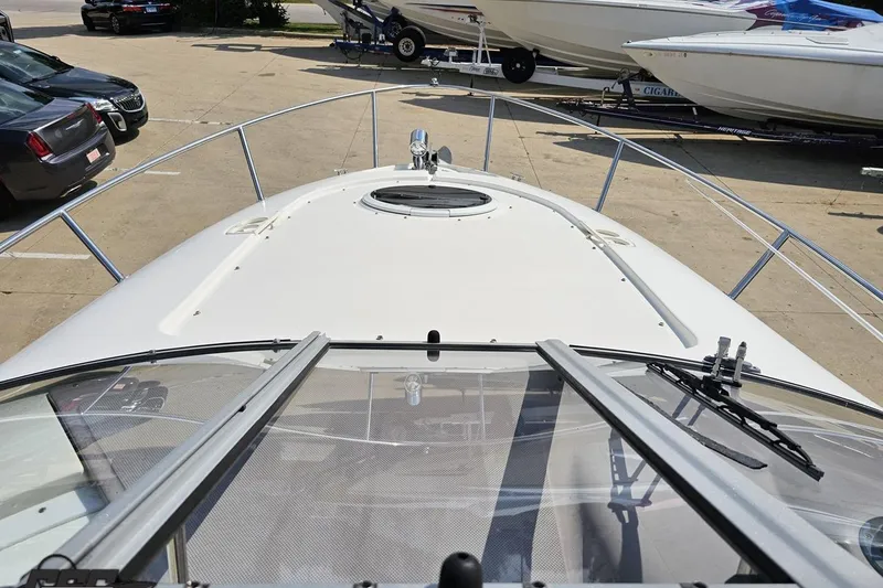 Slide: The Image of 2003 Regal Commodore 2665 boat deck view with windshield and railing. - 51