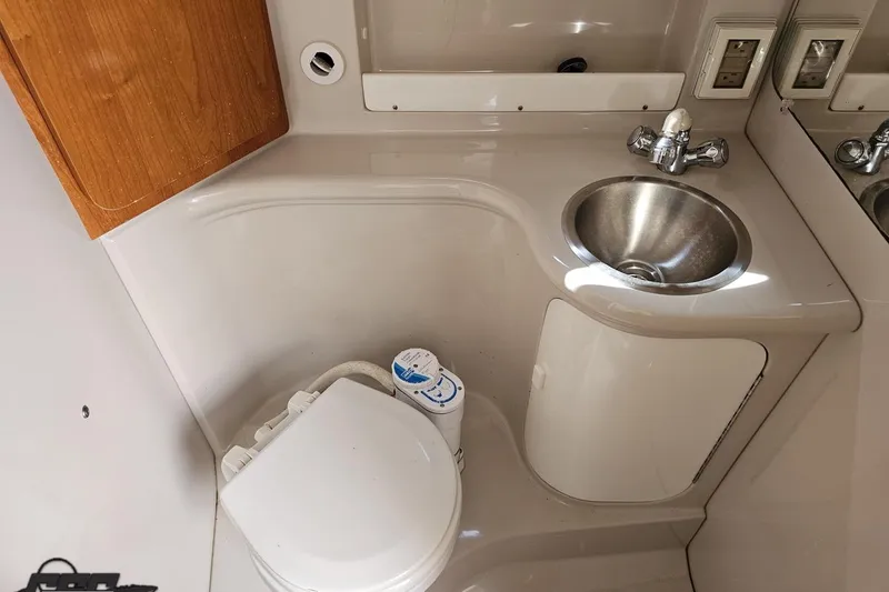 Slide: The Image of 2003 Regal Commodore 2665 boat bathroom with sink and toilet. - 56