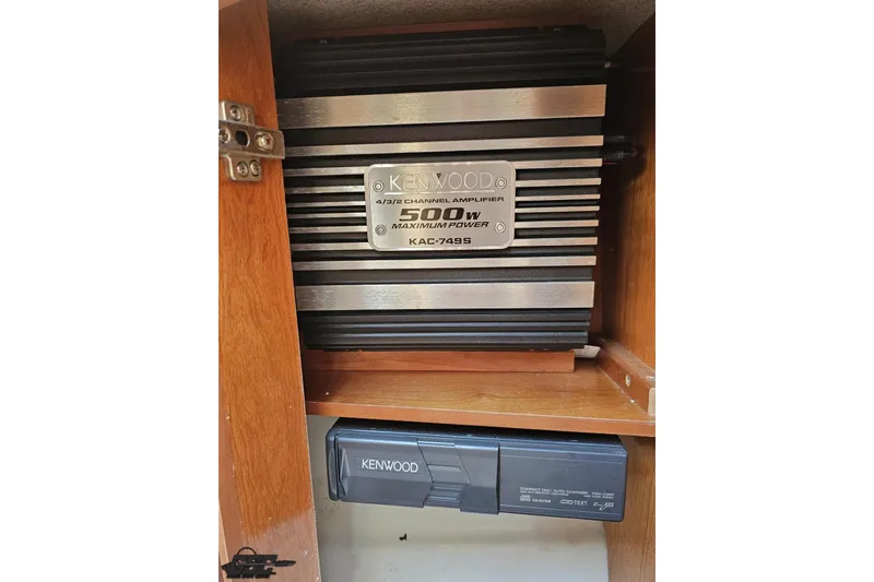 Slide: The Image of Kenwood amplifier in 2003 Regal Commodore 2665 boat cabinet. - 62