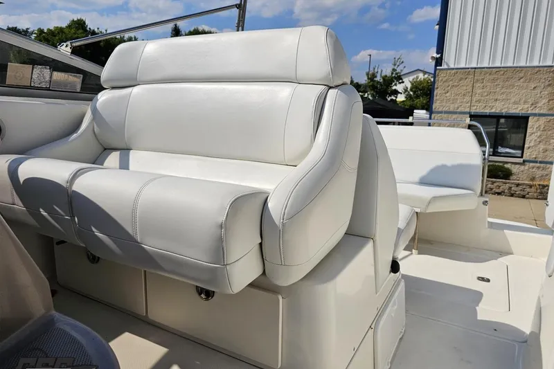 Slide: The Image of 2003 Regal Commodore 2665 boat interior with white leather seating. - 70