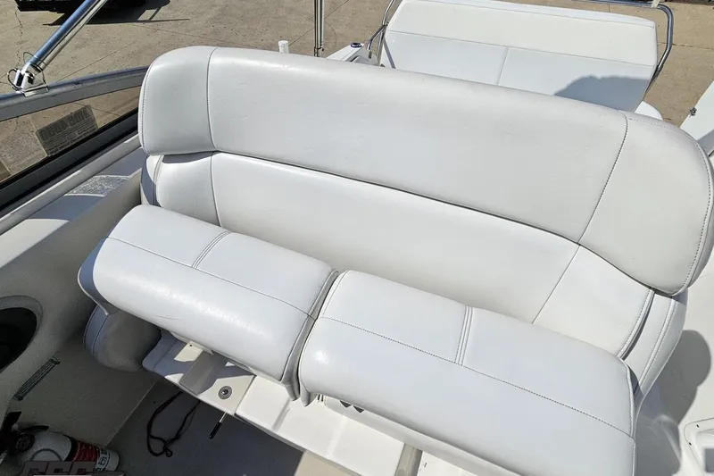 Slide: The Image of 2003 Regal Commodore 2665 boat interior with white leather seating. - 71