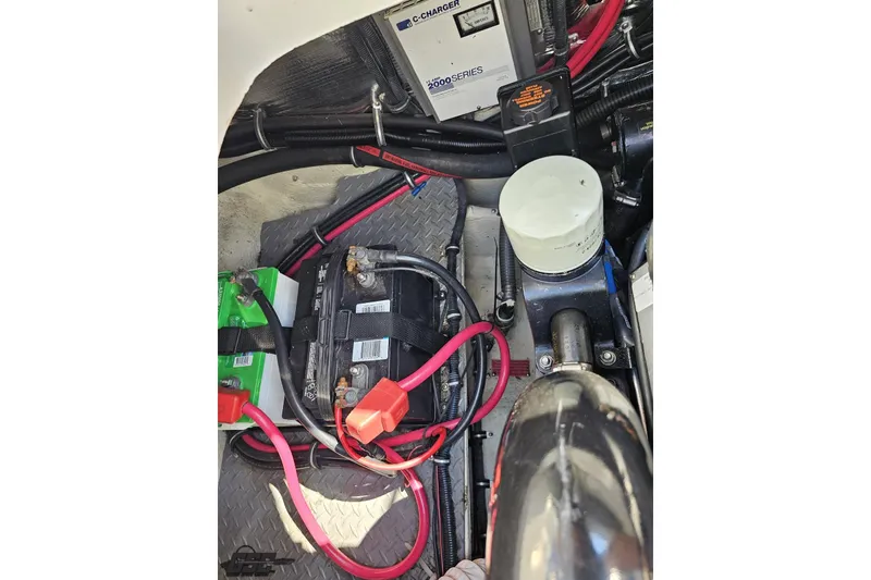 Slide: The Image of Engine compartment of 2003 Regal Commodore 2665 with battery and wiring. - 78