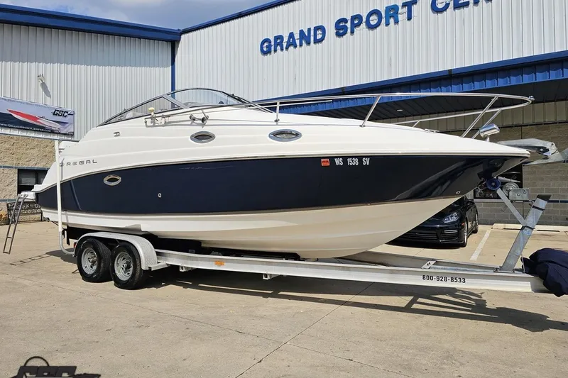 Slide: The Image of 2003 Regal Commodore 2665 boat on trailer at Grand Sport Center. - 9