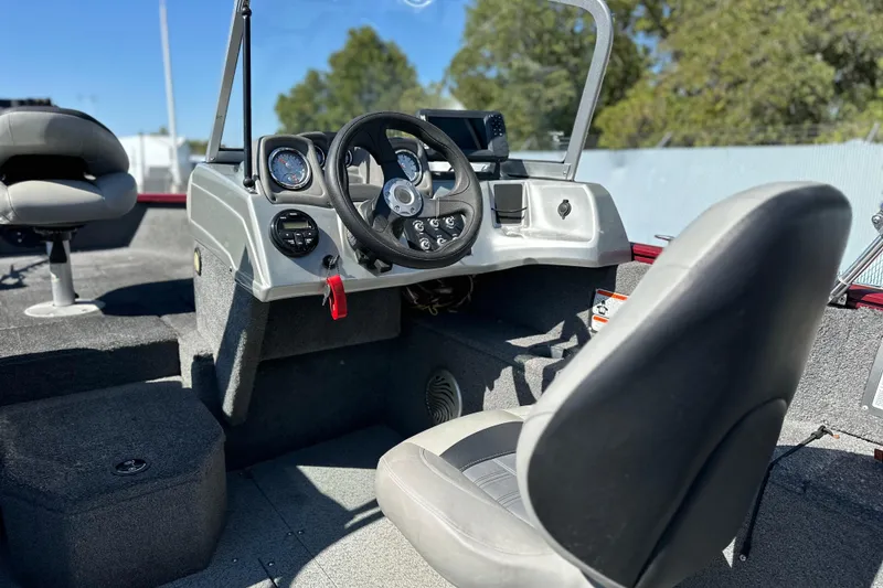Slide: The Image of 2018 Tracker Pro Guide V-175 WT boat interior with steering wheel and seating. - 10