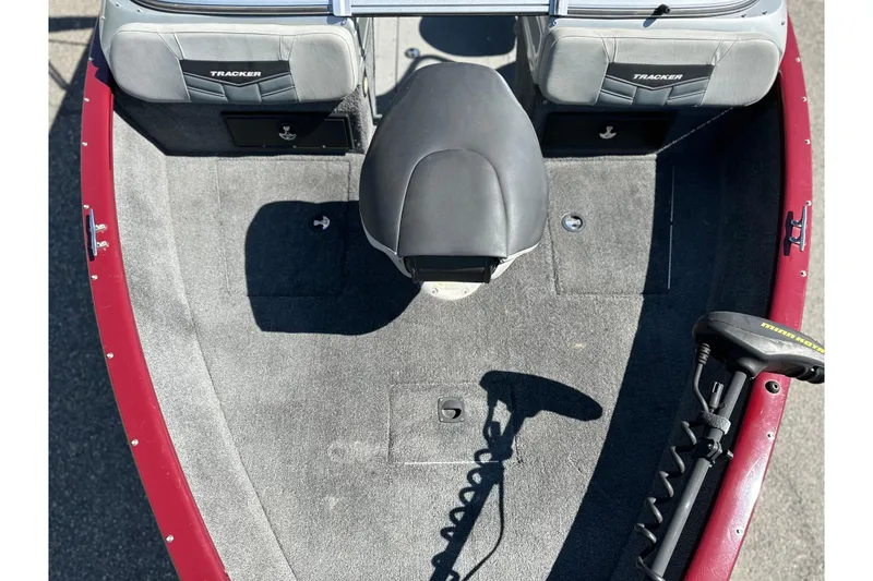Slide: The Image of 2018 Tracker Pro Guide V-175 WT boat interior with seating and trolling motor. - 4