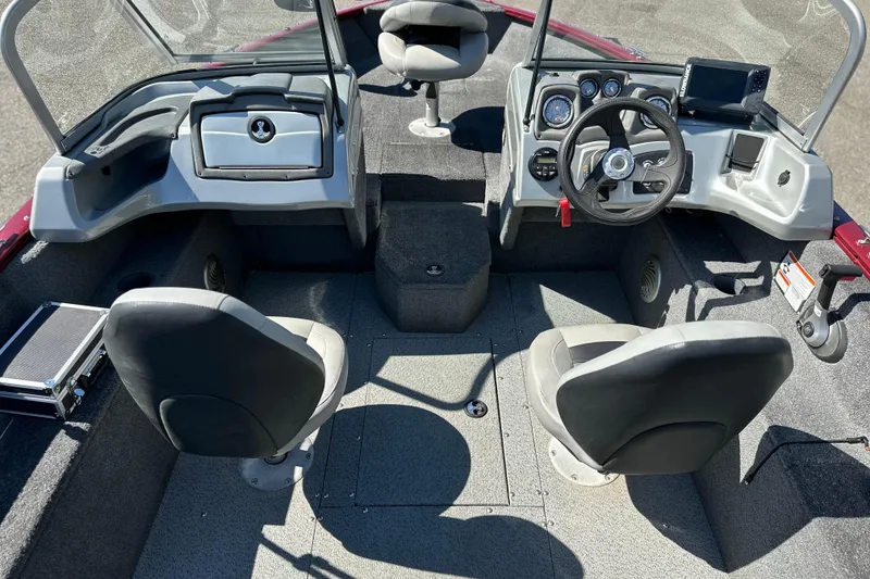 Slide: The Image of 2018 Tracker Pro Guide V-175 WT boat interior with steering console and seating. - 9