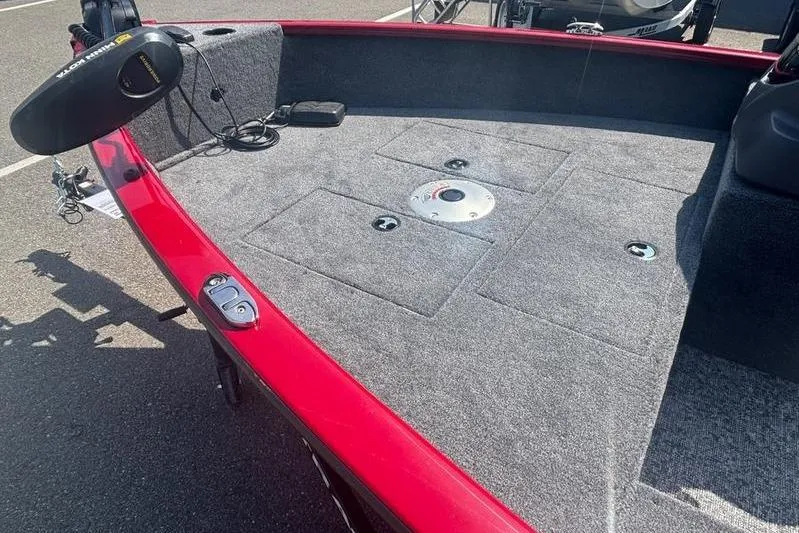 Slide: The Image of 2026 Tracker SG V16 SC boat deck with red trim and carpeted surface. - 5