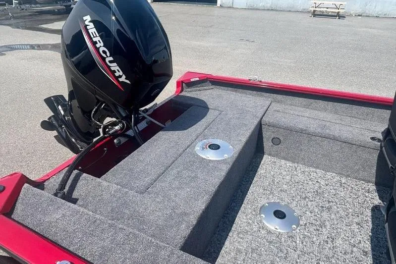 Slide: The Image of 2026 Tracker SG V16 SC boat with Mercury outboard engine, gray carpeted deck. - 7