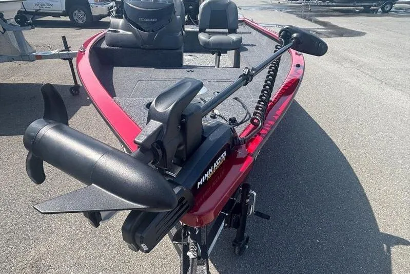 Slide: The Image of Red 2026 Tracker SG V16 SC boat with Minn Kota trolling motor. - 9