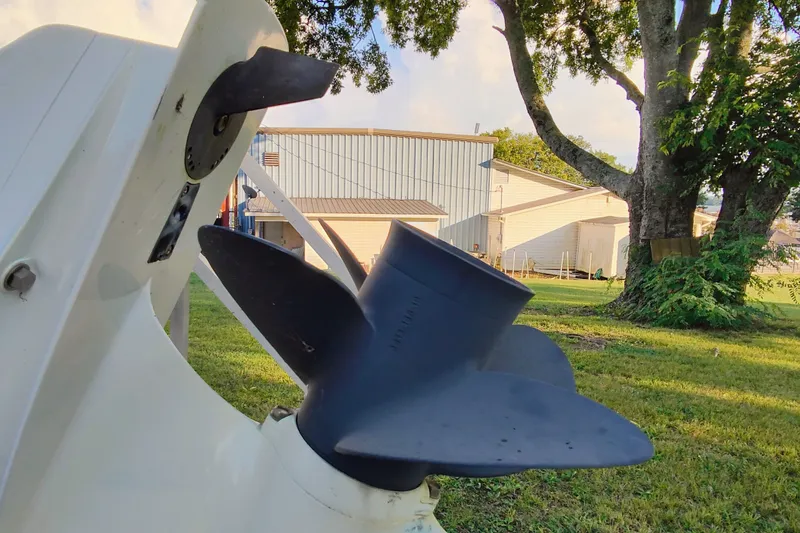 Slide: The Image of Close-up of a 2018 Hurricane SD187 boat propeller in a grassy yard. - 10