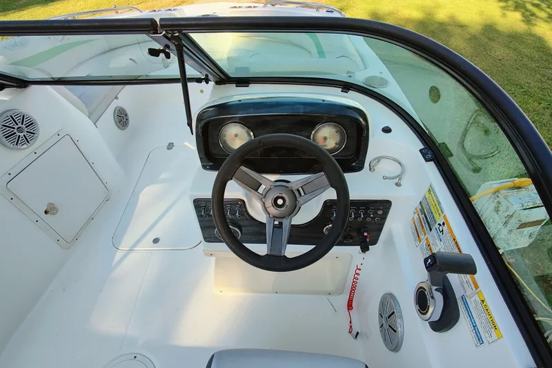 Slide: The Image of 2018 Hurricane SD187 boat cockpit with steering wheel and control panel. - 11