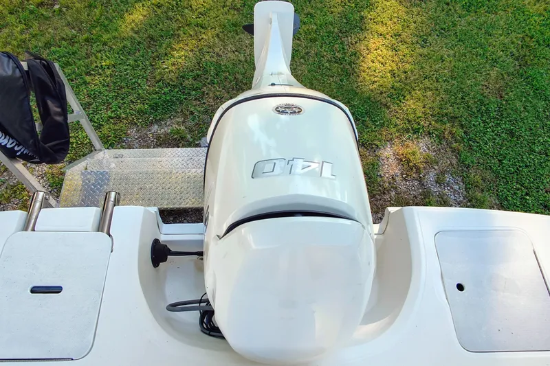Slide: The Image of 2018 Hurricane SD187 boat with Yamaha outboard motor, viewed from above on grassy background. - 9