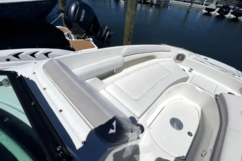 Slide: The Image of 2012 Sea Ray 260 Sundeck boat docked at marina, covered and secured. - 10