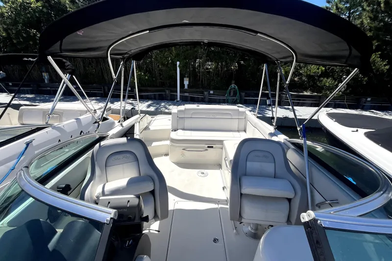 Slide: The Image of 2012 Sea Ray 260 Sundeck boat interior with white seating and Yamaha outboard motor. - 14