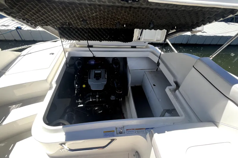 Slide: The Image of Interior of 2012 Sea Ray 260 Sundeck boat with storage and portable toilet. - 23