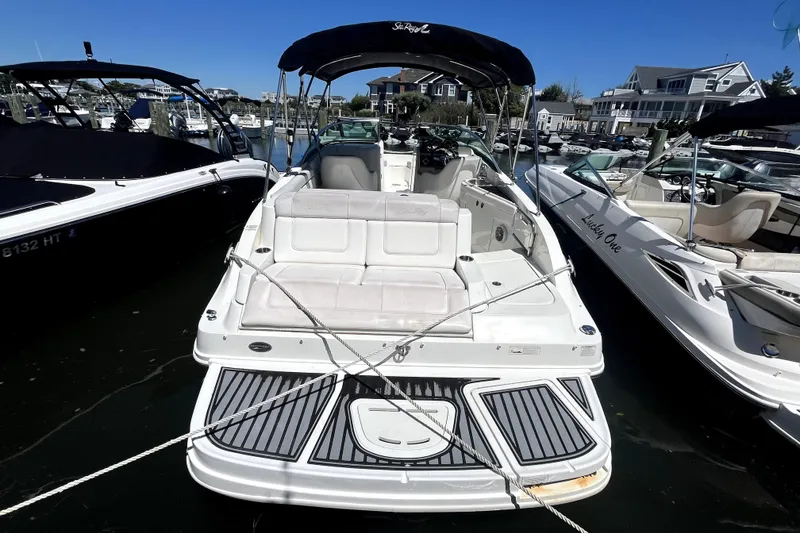 Slide: The Image of 2012 Sea Ray 260 Sundeck interior with sink and seating area. - 26