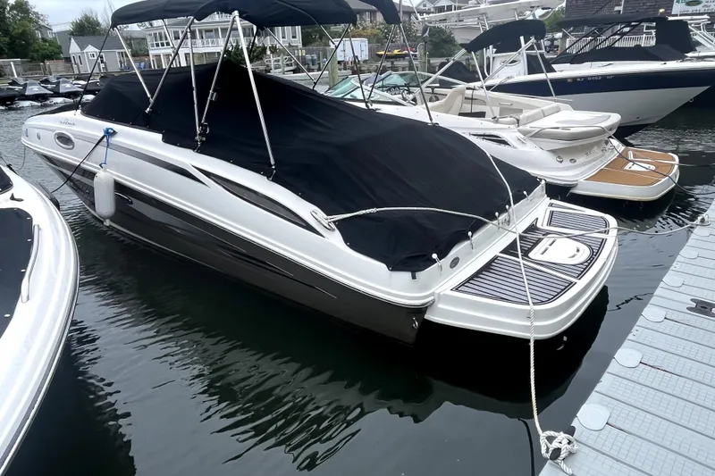Slide: The Image of 2012 Sea Ray 260 Sundeck engine compartment with open hatch, dockside view. - 28