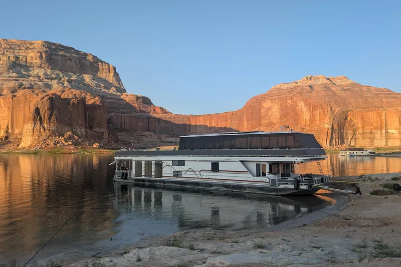 The Image of Houseboat Sumerset 8516 (2002) docked by scenic red rock cliffs and calm water. - 1