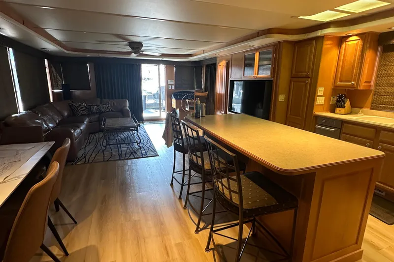 Slide: The Image of Luxurious interior of a 2002 Sumerset 8516 houseboat with modern kitchen and cozy living area. - 4