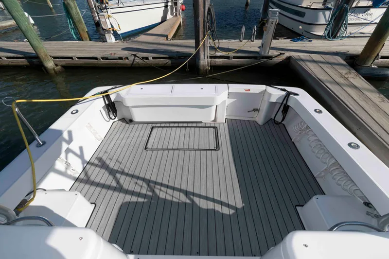 Slide: The Image of 1998 Luhrs 32 Open boat deck with clean, spacious layout at dock. - 4