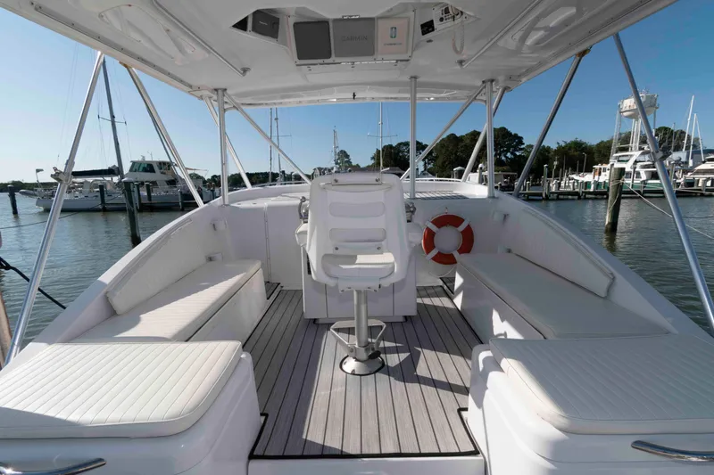 Slide: The Image of 1998 Luhrs 32 Open boat interior with seating and helm, docked at marina. - 5