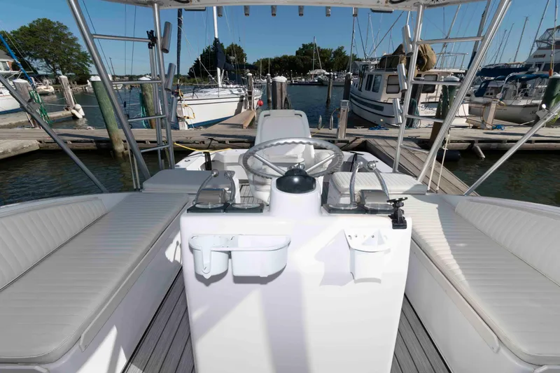 Slide: The Image of 1998 Luhrs 32 Open boat interior with helm, docked at marina. - 9