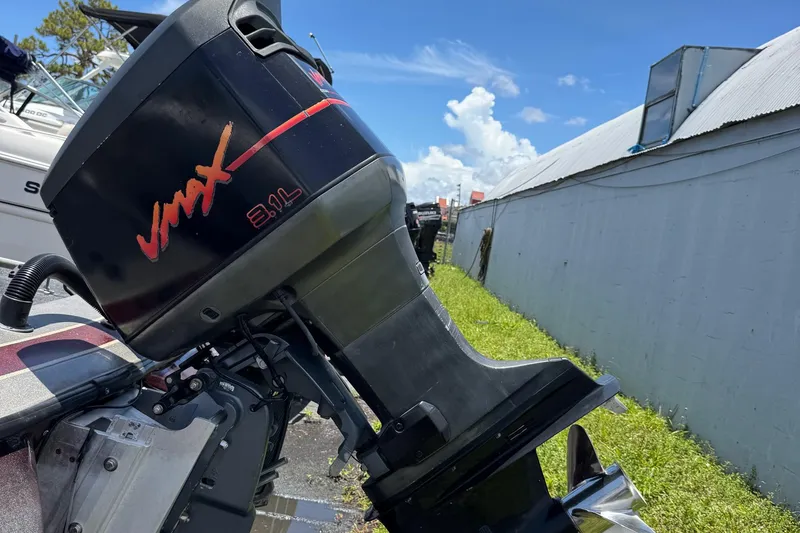 Slide: The Image of 1999 Skeeter ZX 195 boat with VMAX 3.1L engine, parked outdoors. - 25