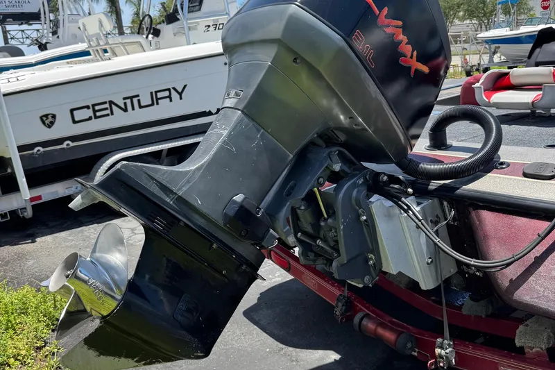Slide: The Image of 1999 Skeeter ZX 195 boat with VMAX 2.1L engine, parked near Century boat. - 27