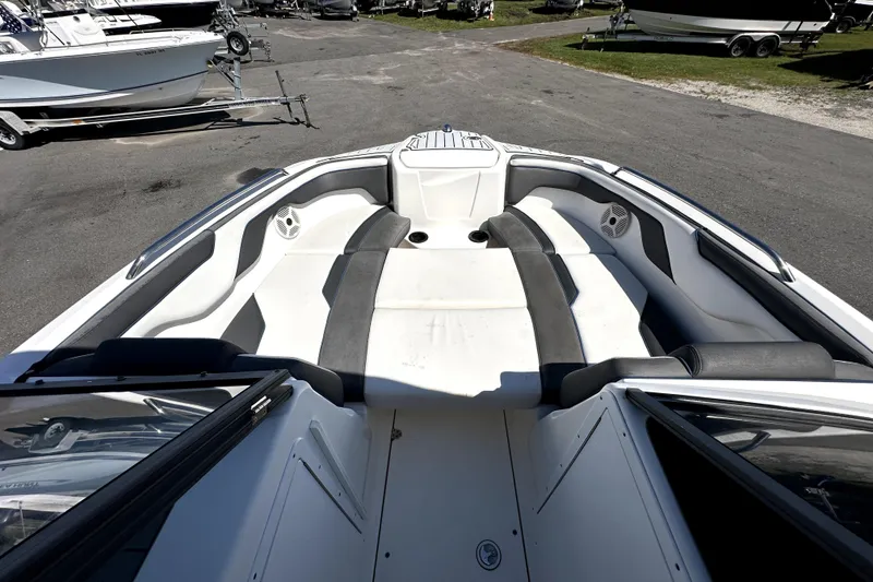 Slide: The Image of 2020 Yamaha Boats SX210 interior with spacious seating and sleek design. - 22