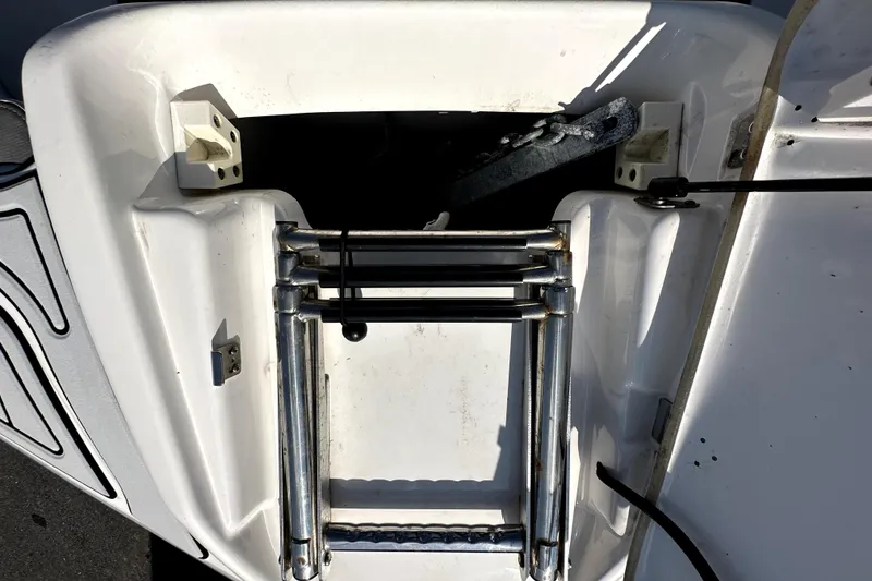 Slide: The Image of 2020 Yamaha SX210 boat ladder and anchor storage area. - 24