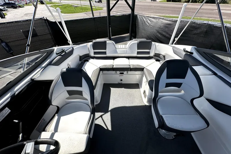 Slide: The Image of 2020 Yamaha Boats SX210 interior with seating and steering wheel, showcasing modern design. - 31