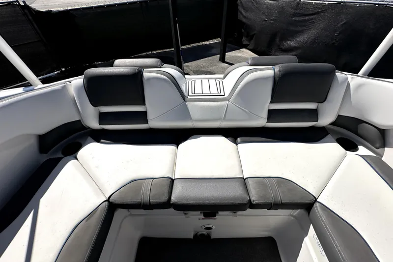 Slide: The Image of 2020 Yamaha Boats SX210 interior seating with black and white upholstery. - 38