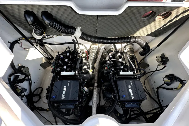 Slide: The Image of Engine compartment of a 2020 Yamaha Boats SX210, showcasing dual engines and wiring. - 39