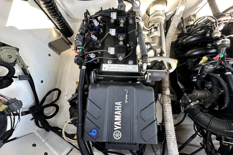 Slide: The Image of Engine compartment of a 2020 Yamaha Boats SX210, showcasing detailed wiring and components. - 40