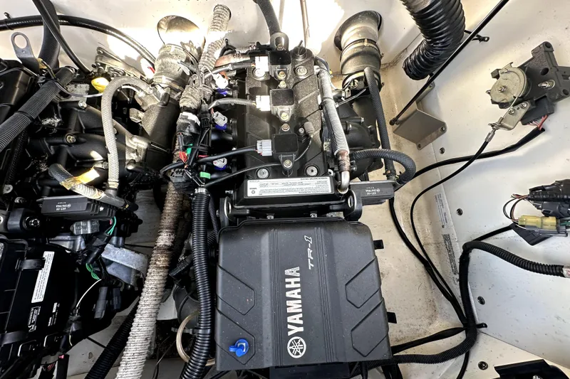 Slide: The Image of Engine compartment of a 2020 Yamaha Boats SX210, showcasing intricate wiring and components. - 41